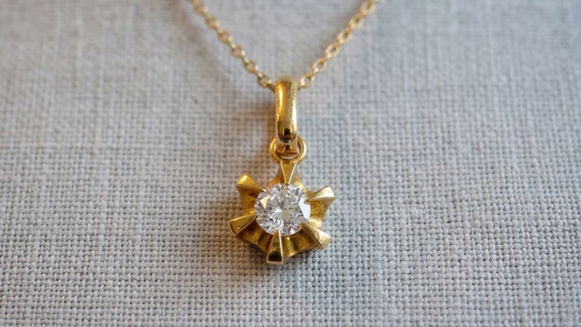 Diamond pendant on light background